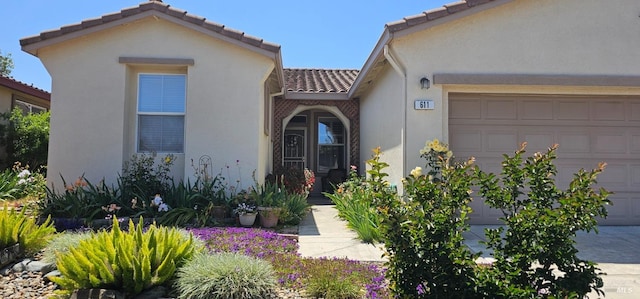 611 Twin Lakes Ln, Rio Vista, CA 94571 - view of front facade with a tiled roof, a garage, and stucco siding