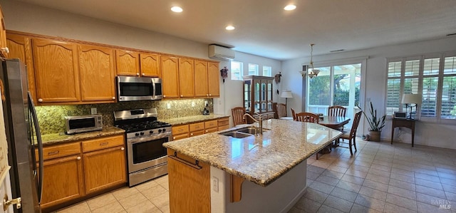 611 Twin Lakes Ln, Rio Vista, CA 94571 - kitchen with appliances with stainless steel finishes, a sink, a wall mounted air conditioner, recessed lighting, and decorative backsplash