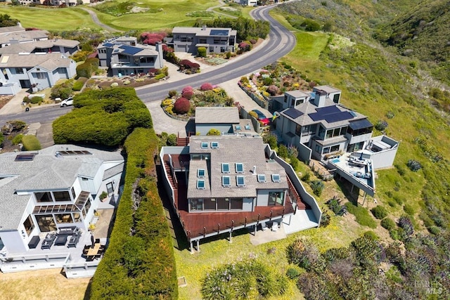 aerial view of residential area featuring a golf club