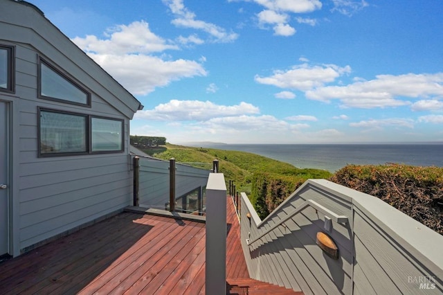 wooden deck featuring a water view