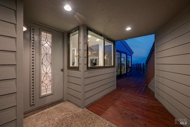 entrance to property featuring a deck