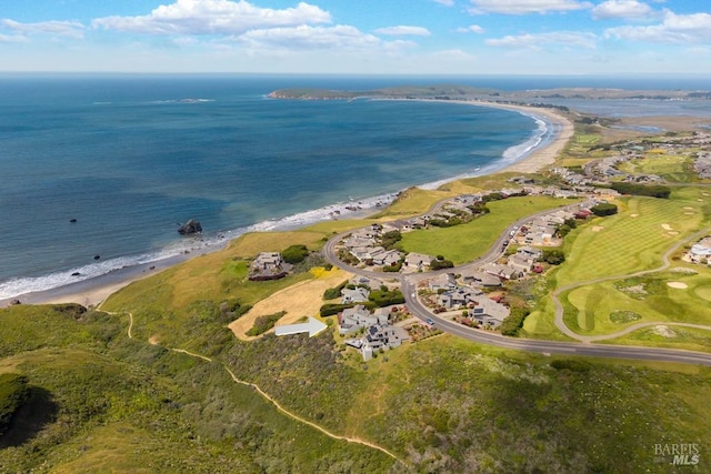 aerial overview of property's location with waterfront with a beach