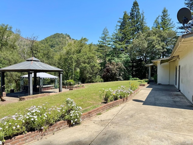 4511 Dry Creek Rd, Napa, CA 94558 - view of patio featuring a gazebo and a wooded view
