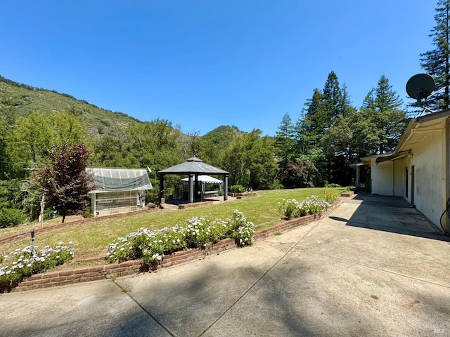 4511 Dry Creek Rd, Napa, CA 94558 - view of patio / terrace featuring a gazebo, an exterior structure, and a wooded view