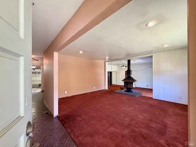 4511 Dry Creek Rd, Napa, CA 94558 - below grade area with a wood stove, carpet flooring, and recessed lighting