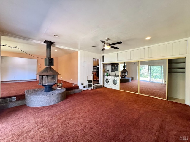 4511 Dry Creek Rd, Napa, CA 94558 - carpeted living room featuring a wood stove, independent washer and dryer, ceiling fan, and recessed lighting
