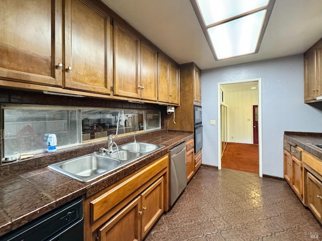 4511 Dry Creek Rd, Napa, CA 94558 - kitchen featuring stainless steel dishwasher, black dishwasher, a sink, dark flooring, and backsplash