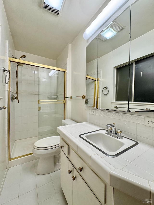 4511 Dry Creek Rd, Napa, CA 94558 - bathroom with toilet, tile patterned floors, a shower stall, and backsplash