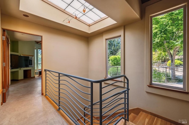 1 Dover Rd, Inverness, CA 94937 - hallway featuring a skylight, healthy amount of natural light, and an upstairs landing