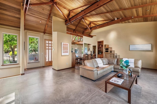 1 Dover Rd, Inverness, CA 94937 - living room with baseboards, concrete floors, wooden ceiling with exposed beams, and a high ceiling