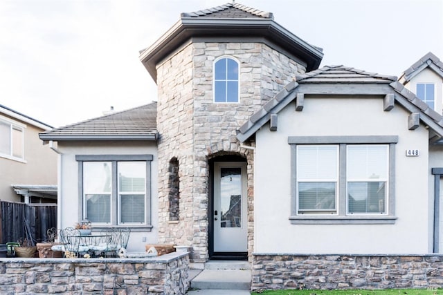 448 Royal Tern Dr, Vacaville, CA 95687 - french country home with stucco siding, stone siding, and fence