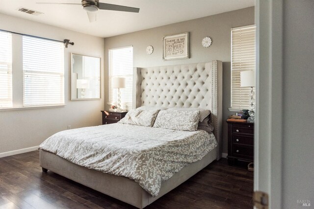 bedroom featuring dark wood-style floors, baseboards, and a ceiling fan