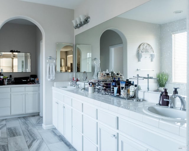 bathroom with double vanity