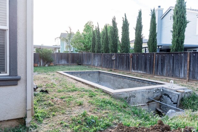 view of swimming pool featuring a fenced backyard