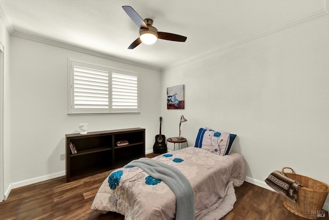 bedroom with ornamental molding, wood finished floors, baseboards, and ceiling fan