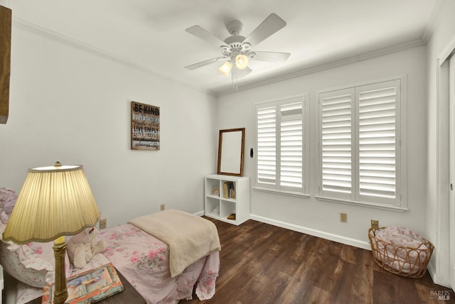 bedroom with baseboards, wood finished floors, crown molding, and a ceiling fan