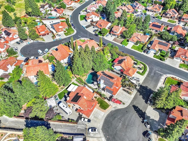 aerial view of property and surrounding area with nearby suburban area