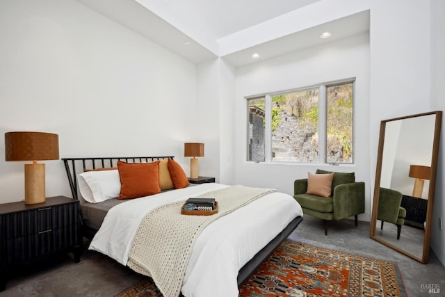 carpeted bedroom featuring recessed lighting and lofted ceiling