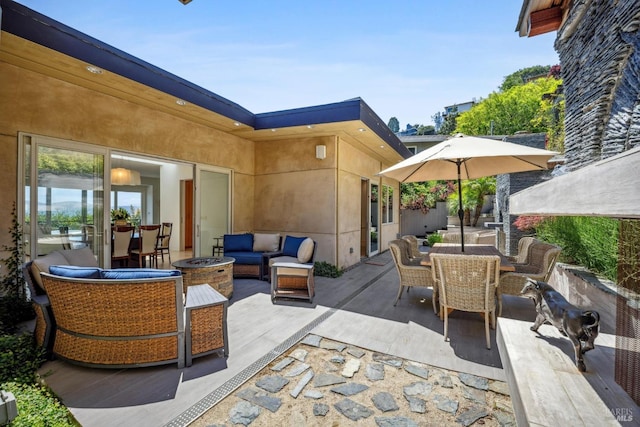 view of patio / terrace with outdoor dining area and an outdoor living space