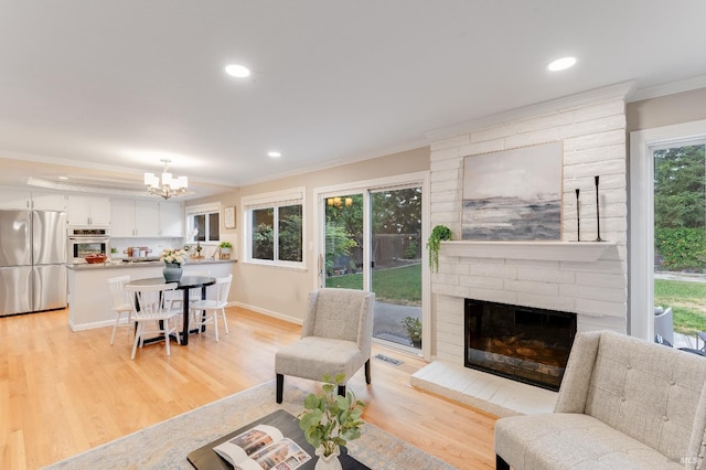 587 El Capitan Dr, Danville, CA 94526 - living area with crown molding, light wood finished floors, recessed lighting, a fireplace, and baseboards
