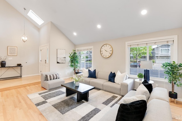 587 El Capitan Dr, Danville, CA 94526 - living room featuring a skylight, wood finished floors, baseboards, high vaulted ceiling, and recessed lighting