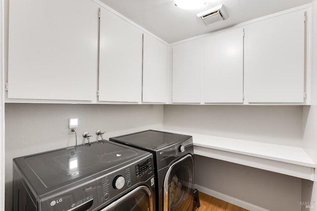 587 El Capitan Dr, Danville, CA 94526 - laundry area featuring separate washer and dryer, cabinet space, and wood finished floors