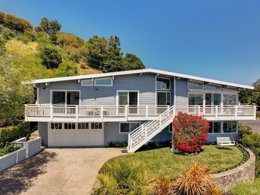 24 Via Navarro, Greenbrae, CA 94904 - view of front of house with a garage, concrete driveway, and stairs