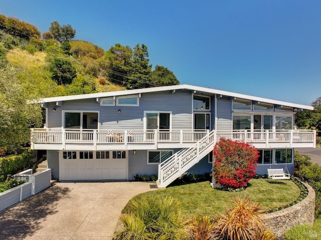 24 Via Navarro, Greenbrae, CA 94904 - view of front of house with a garage, concrete driveway, and stairs
