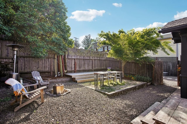 fenced backyard with a patio area