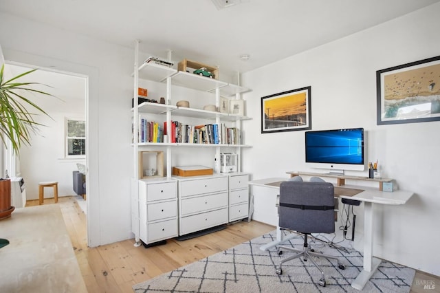 office space with light wood-style floors
