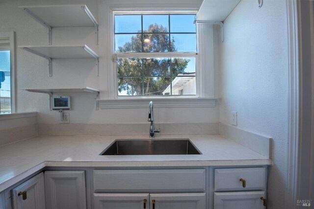 7 Sims Ave, Vallejo, CA 94590 - kitchen with a sink, plenty of natural light, light countertops, and open shelves