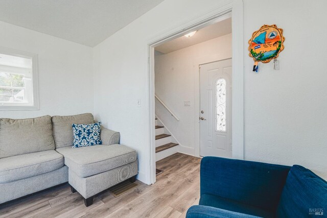 7 Sims Ave, Vallejo, CA 94590 - living area featuring light wood-style flooring and stairway