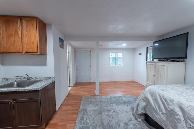 7 Sims Ave, Vallejo, CA 94590 - bedroom with light wood finished floors, a sink, and baseboards