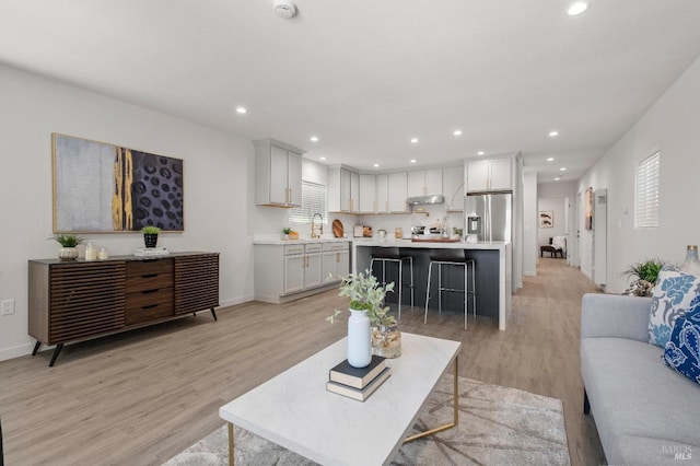 513 Verde Ave, Richmond, CA 94801 - living room with light wood-style flooring, recessed lighting, and baseboards