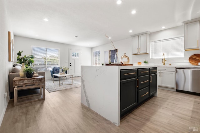 513 Verde Ave, Richmond, CA 94801 - kitchen featuring dishwasher, light wood-style flooring, recessed lighting, a sink, and open floor plan