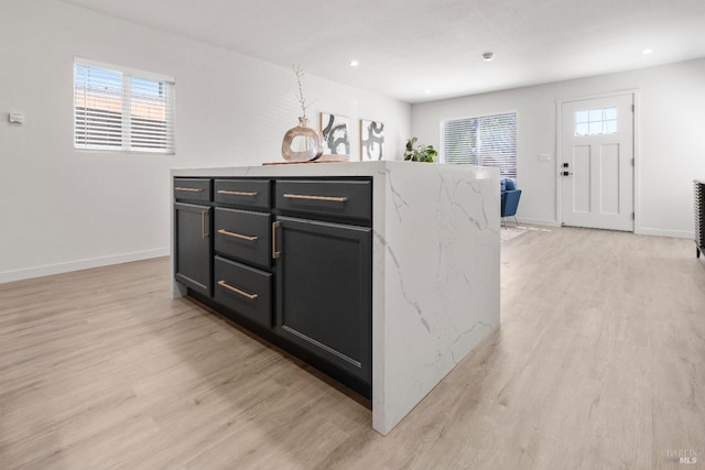 513 Verde Ave, Richmond, CA 94801 - kitchen with light wood-style floors, dark cabinetry, light stone countertops, baseboards, and recessed lighting