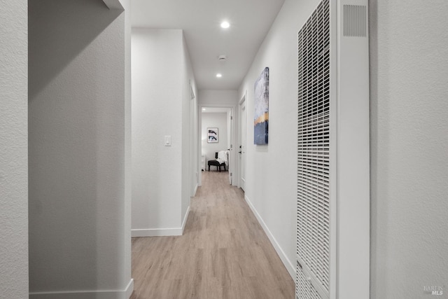 513 Verde Ave, Richmond, CA 94801 - corridor with a heating unit, light wood finished floors, recessed lighting, and baseboards