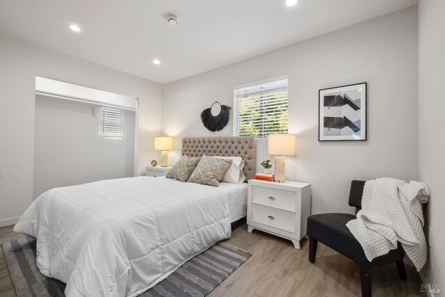 513 Verde Ave, Richmond, CA 94801 - bedroom featuring light wood-style floors, multiple windows, and recessed lighting