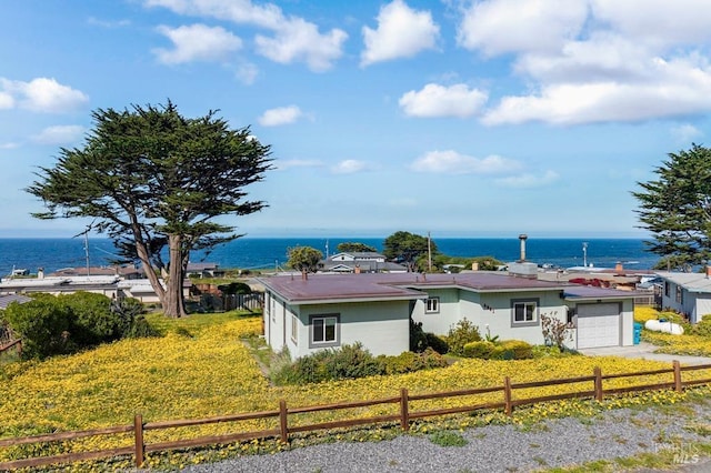 4981 Conch Ave, Bodega Bay, CA 94923 - view of front of home with a water view, an attached garage, and fence