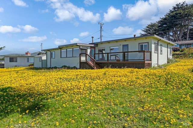 4981 Conch Ave, Bodega Bay, CA 94923 - rear view of house featuring a deck and concrete block siding