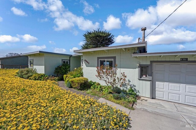 4981 Conch Ave, Bodega Bay, CA 94923 - view of front facade with concrete block siding and a garage