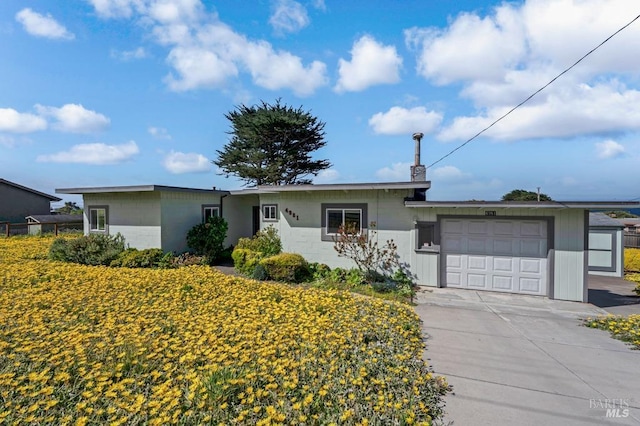 4981 Conch Ave, Bodega Bay, CA 94923 - single story home featuring a garage, concrete block siding, and concrete driveway