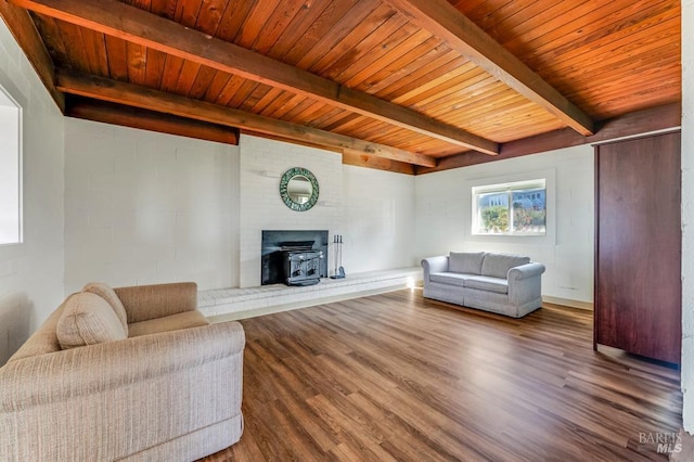 4981 Conch Ave, Bodega Bay, CA 94923 - living room featuring a wood stove, wood finished floors, beam ceiling, and wood ceiling