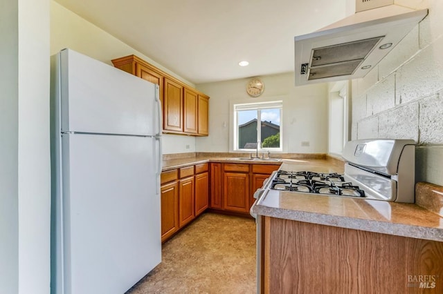 4981 Conch Ave, Bodega Bay, CA 94923 - kitchen with white appliances, a sink, brown cabinetry, light countertops, and exhaust hood