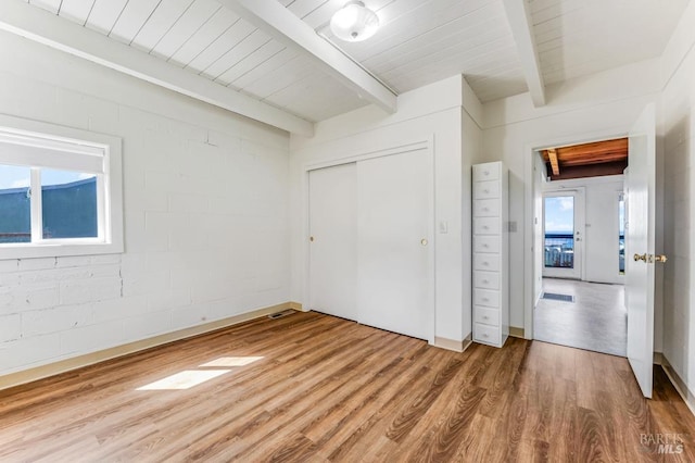4981 Conch Ave, Bodega Bay, CA 94923 - unfurnished bedroom featuring beam ceiling, wood finished floors, a closet, and wooden ceiling