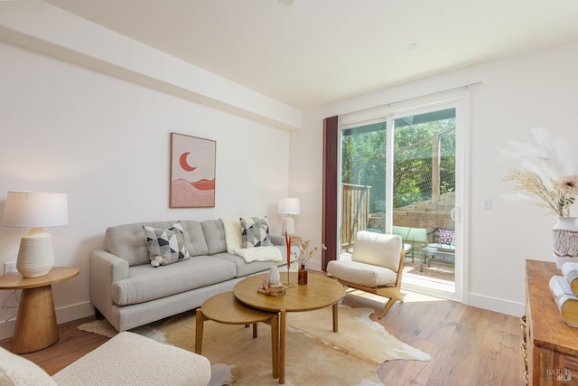 living room with light wood-style floors and baseboards
