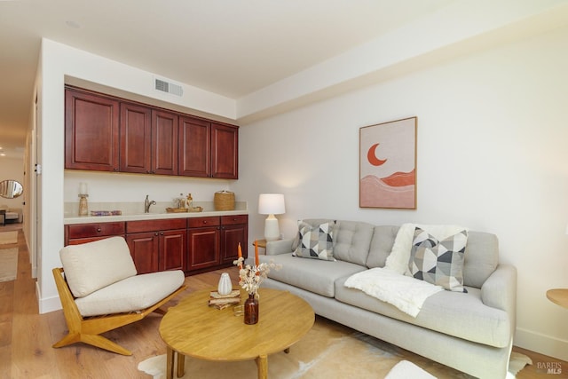 living room with light wood-style floors and baseboards