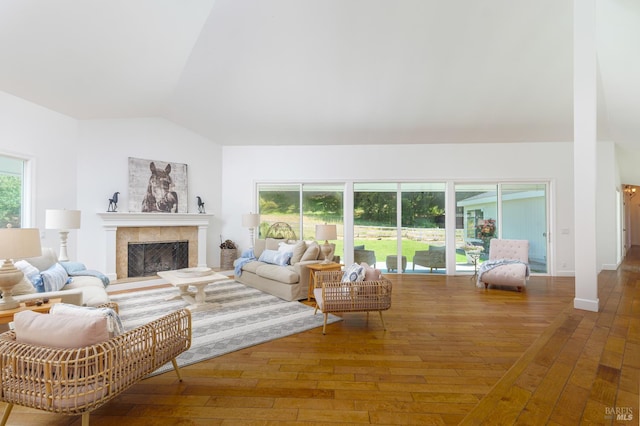 155 H Ln, Novato, CA 94945 - living area featuring vaulted ceiling, hardwood / wood-style floors, and a tiled fireplace