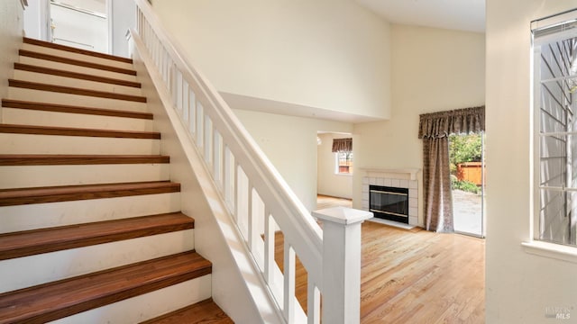 830 Chardonnay Cir, Petaluma, CA 94954 - stairs with a high ceiling, wood finished floors, and a fireplace