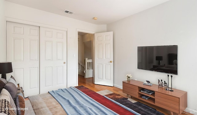 830 Chardonnay Cir, Petaluma, CA 94954 - bedroom with wood finished floors, a closet, and baseboards